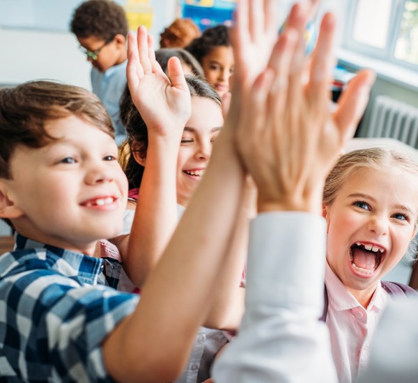 Children Giving Teacher High Five