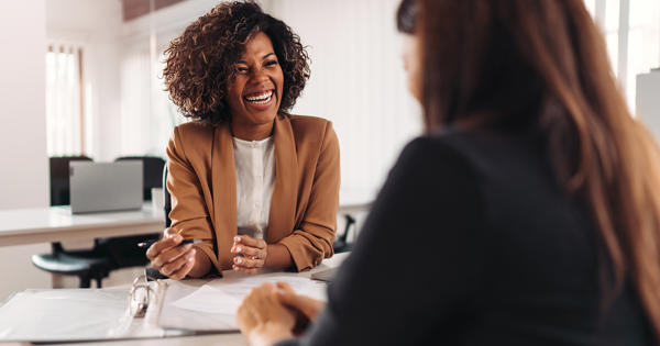 Two Women Talking Customer And Housing Officer