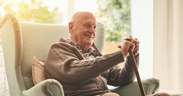 Older Man Sat On His Chair At Home