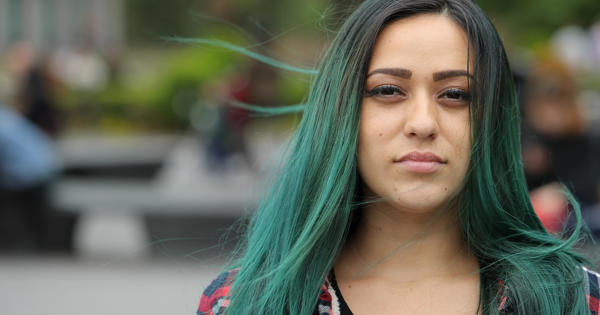 Woman With Black To Green Dip Dyed Hair