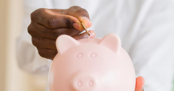 Young Man Saving Money