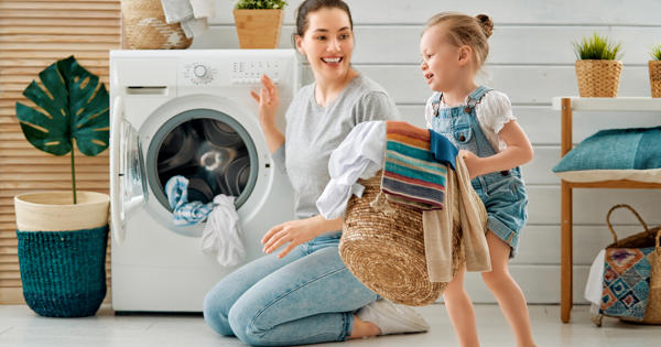 Mum And Child Doing The Washing Together