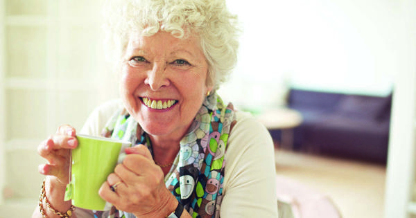 Older Lady Drinking Tea At Home