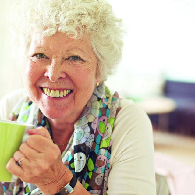 Older Lady Drinking Tea At Home