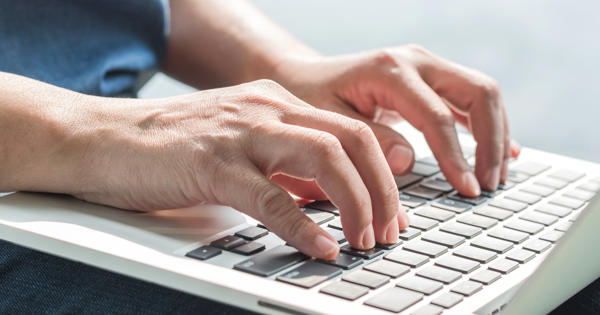 Hands Using Laptop