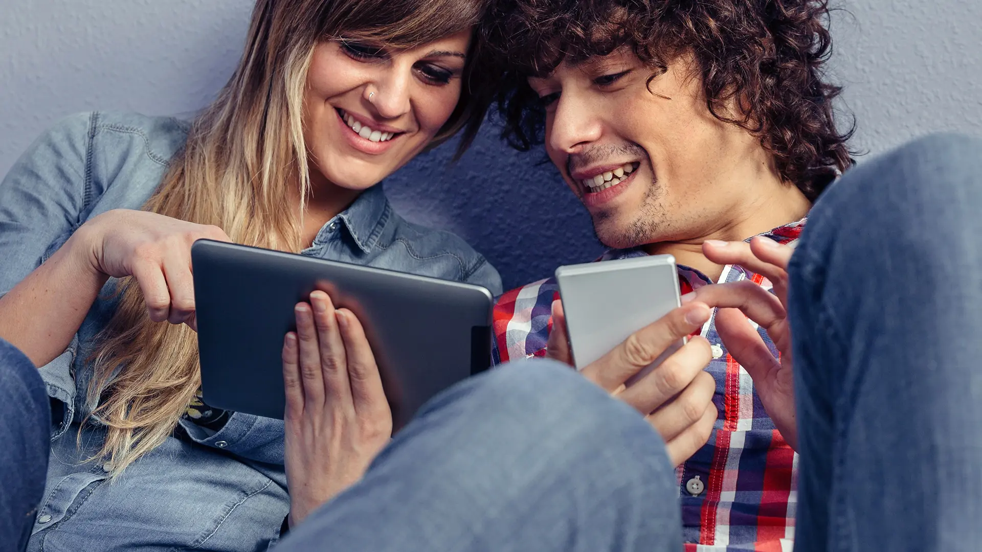 Couple Looking At Tablet