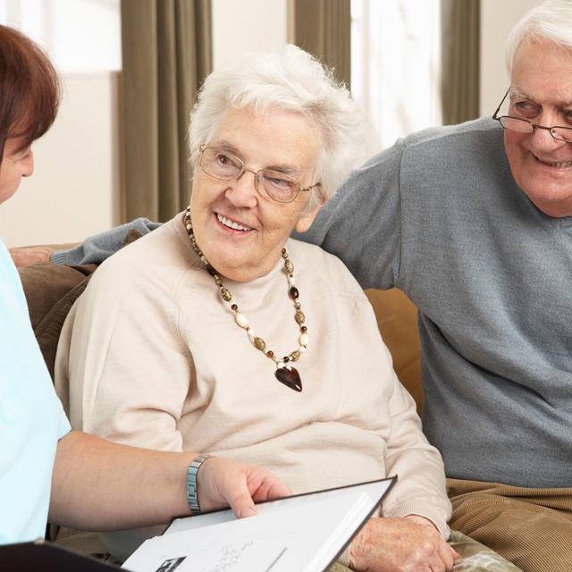 Older Couple Have Visit From Lady With Clipboard